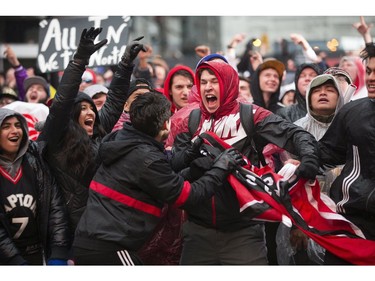 The Toronto Raptors' faithful  fans celebrate  in Jurassic Park as their Raptors play against the Philadelphia 76ers,   in Toronto, Ont. on Sunday, May 12, 2019