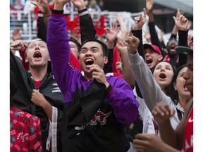 Jurassic Park comes alive as Raptor fans cheer on their team in Game 3 against the Milwaukee Bucks in Toronto on May, 19, 2019. Stan Behal/Toronto Sun