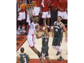 Double Overtime action as Kawhi Leonard scores the go ahead basket  in Game 3 of the Eastern Conference Finals as the Toronto Raptors go on to beat the Milwaukee Bucks,  in Toronto, Ont. on Monday May 20, 2019. Stan Behal/Toronto Sun/Postmedia Network