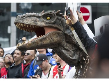 Jurassic Park comes alive Sunday night as Raptor fans cheer on their team in Game 3 against the Milwaukee Bucks in Toronto, Ont. on Sunday May, 19, 2019. Stan Behal/Toronto Sun/Postmedia Network