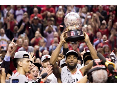 Kawhi Leonard holds the Cup as the Toronto Raptors clinch Game 6 winning the Eastern Conference Championship Trophy beating the Milwaukee Bucks,  in Toronto, Ont. on Saturday May 25, 2019. Stan Behal/Toronto Sun/Postmedia Network