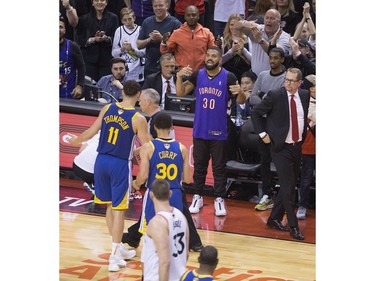 Klay Thompson gets grief from Drake after a foul call in the 4th quarter  as  the Toronto Raptors beat the Golden State Warriors in Game 1 of the NBA Finals in Toronto. on Friday May 31, 2019. Stan Behal/Toronto Sun/Postmedia Network