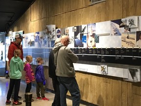 People take in the timeline of space exploration at the Armstrong Air and Space Museum in Wapakoneta, Ohio. THE CANADIAN PRESS/Kevin Bissett