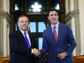 Prime Minister Justin Trudeau shakes hands with Alberta Premier Jason Kenney in his office on Parliament Hill in Ottawa on Thursday, May 2, 2019.