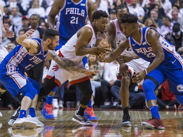 Toronto Raptors Kyle Lowry during playoff action against Philadelphia 76ers JJ Redick (left) and Jimmy Butler at the Scotiabank Arena  in Toronto, Ont. on Tuesday May 7, 2019. Ernest Doroszuk/Toronto Sun/Postmedia