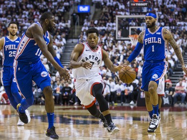 Toronto Raptors Kyle Lowry during playoff action against Philadelphia 76ers James Ennis III (left) and Mike Scott at the Scotiabank Arena  in Toronto, Ont. on Tuesday May 7, 2019. Ernest Doroszuk/Toronto Sun/Postmedia