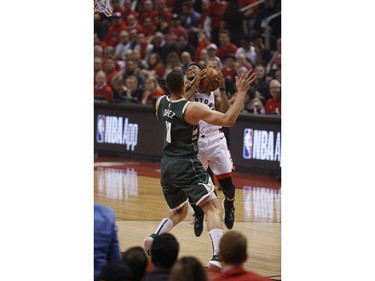 Toronto Raptors Kyle Lowry PG (7) fouled by Milwaukee Bucks Brook Lopez C (11) during the first half in Toronto, Ont. on Tuesday May 21, 2019. Jack Boland/Toronto Sun/Postmedia Network