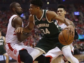 Toronto Raptors Serge Ibaka C (9) defends against Milwaukee Bucks Giannis Antetokounmpo PF (34) during the first half in Toronto, Ont. on Tuesday May 21, 2019. Jack Boland/Toronto Sun/Postmedia Network