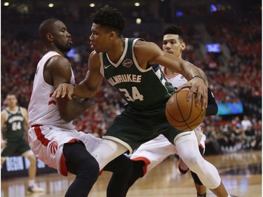 Toronto Raptors Serge Ibaka C (9) defends against Milwaukee Bucks Giannis Antetokounmpo PF (34) during the first half in Toronto, Ont. on Tuesday May 21, 2019. Jack Boland/Toronto Sun/Postmedia Network