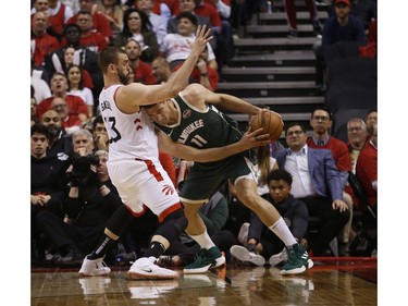 Milwaukee Bucks Brook Lopez C (11) tries to push through Toronto Raptors Marc Gasol C (33) during the second half in Toronto, Ont. on Tuesday May 21, 2019. Jack Boland/Toronto Sun/Postmedia Network