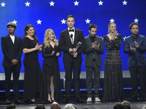In this Jan. 13, 2019, file photo, Kunal Nayyar, from left, Mayim Bialik, Melissa Rauch, Jim Parsons, Simon Helberg, Kaley Cuoco and Johnny Galecki, from the cast of "The Big Bang Theory," present the creative achievement award at the 24th annual Critics' Choice Awards at the Barker Hangar in Santa Monica, Calif. Hugs and tears punctuated the final taping of "The Big Bang Theory," a lovefest for its stars, crew and audience alike. There were plenty of punchlines as well, as the true-to-form hit comedy about scientists and those who love them wrapped the two-part, hour-long finale that will air in mid-May on CBS.