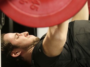 Tyler Crapigna bench presses during the CFL combine a few years ago. The kicker is hoping to land a spot with the Argonauts. (CRAIG ROBERTSON/TORONTO SUN FILES)