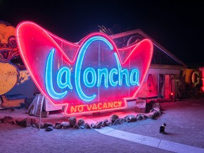 A restored neon sign from the long-defunct La Concha hotel glows brightly in the boneyard at the Neon Museum in Las Vegas. Bryan Passifiume/Toronto Sun