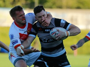 Blake Wallace of the Toronto Wolfpack is tackled by a Sheffield Eagle in a Betfred Championship rugby league game on May 24, 2019, at Olympic Legacy Park in Sheffield, England (THE CANADIAN PRESS/HO - Touchline Pics, Steve Guant)