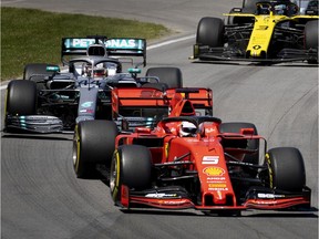 Ferrari's Sebastian Vettel leads the pack into the first turn during the Canadian Grand Prix at the Circuit Gilles-Villeneuve in Montreal on June 9, 2019.