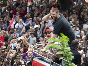 Raptors’ Marc Gasol calls out to the crowd while riding the bus at the championship parade yesterday. USA TODAY