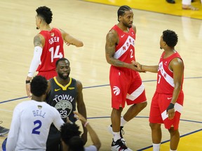 Toronto Raptors' Kawhi Leonard and Kyle Lowry (right) shake hands after Friday's Game 4 win. (USA TODAY SPORTS)
