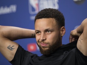 Warriors guard Stephen Curry speaks to the media on Sunday afternoon ahead of Monday's Game 5 in Toronto. (STAN BEHAL/Toronto Sun)