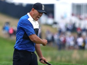 Brooks Koepka of the United States celebrates winning on the 18th green during the final round of the US PGA Championship at Bethpage Black Golf Course on May 19, 2019 in Farmingdale, United States.