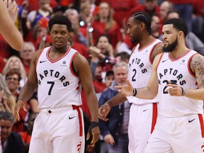 Kyle Lowry #7 and Fred VanVleet #23 of the Toronto Raptors react against the Golden State Warriors in the first half during Game Two of the 2019 NBA Finals at Scotiabank Arena on June 02, 2019 in Toronto, Canada.   (Photo by Gregory Shamus/Getty Images)