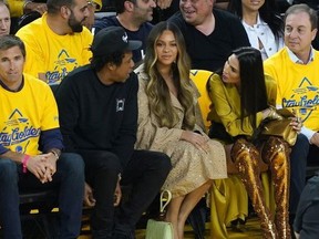 Jay-Z and Beyonce attend Game Three of the 2019 NBA Finals between the Golden State Warriors and the Toronto Raptors at ORACLE Arena on June 05, 2019 in Oakland, California. NOTE TO USER: User expressly acknowledges and agrees that, by downloading and or using this photograph, User is consenting to the terms and conditions of the Getty Images License Agreement.