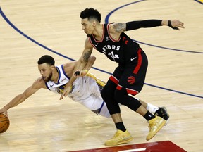 Stephen Curry #30 of the Golden State Warriors battles for the ball with Danny Green of the Toronto Raptors in the second half during Game Three of the 2019 NBA Finals. Getty Images)