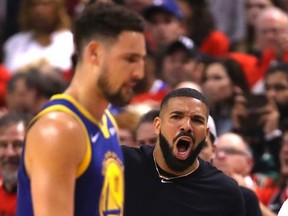 Drake reacts in the first half during Game Five of the 2019 NBA Finals between the Golden State Warriors and the Toronto Raptors at Scotiabank Arena on June 10, 2019 in Toronto, Canada. NOTE TO USER: User expressly acknowledges and agrees that, by downloading and or using this photograph, User is consenting to the terms and conditions of the Getty Images License Agreement.