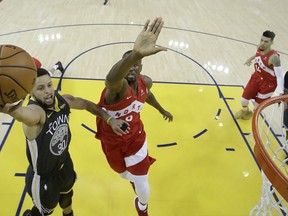 Warriors’ Stephen Curry (right) puts up a shot against the Raptors’ Serge Ibaka during their championship series. Ibaka thinks the Raptors could win two more titles.  Getty Imges