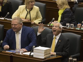 Finance Minsiter Vic Fedeli (right) sits beside Premier Doug Ford in the legislature on Nov. 15, 2018. (Stan Behal, Toronto Sun)