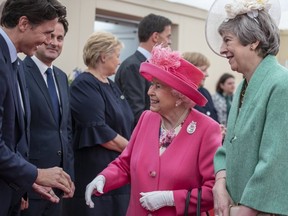 Queen Elizabeth II, accompanied by Prime Minister, Theresa May meet the Canadian PM Justin Trudeau ahead of the National Commemorative Event commemorating the 75th anniversary of the D-Day invasion on June 5, 2019 in Portsmouth, England. ( (Photo by Jack Hill - WPA Pool/Getty Images)