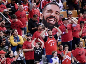 A Toronto Raptors fan holds up a giant cut-out of rapper Drake during Game 2 of the NBA Finals between the Golden State Warriors and the Toronto Raptors at Scotiabank Arena. (Nick Turchiaro-USA TODAY Sports)
