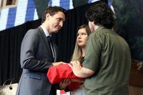 Prime Minister Justin Trudeau is presented with the final report during the closing ceremony of the National Inquiry into Missing and Murdered Indigenous Women and Girls in Gatineau, Quebec, Canada, June 3, 2019. REUTERS/Chris Wattie