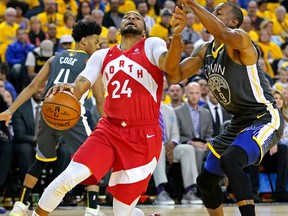 Toronto Raptors forward Norman Powell (24) drives to the basket against Golden State Warriors guard Andre Iguodala (9) during the second quarter in game 4 of the 2019 NBA Finals at Oracle Arena. Kyle Terada-USA TODAY Sports