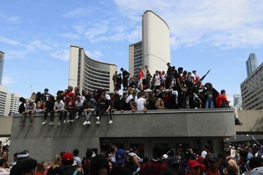 Fans gather at Nathan Phillips Square at City Hall during the Toronto Raptors championship parade.  John E. Sokolowski-USA TODAY Sports