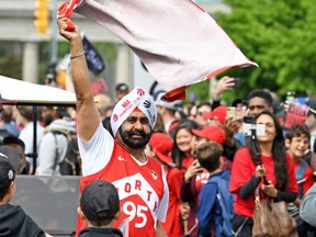 Raptors Superfan Nav Bhatia celebrates with fans during the Toronto Raptors Championship Parade on Lakeshore Boulevard. Gerry Angus-USA TODAY Sports