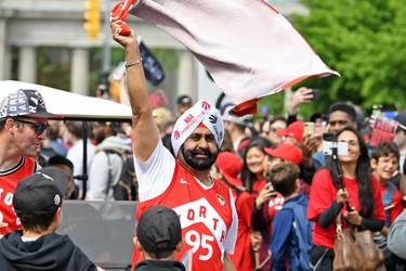 Raptors Superfan Nav Bhatia celebrates with fans during the Toronto Raptors Championship Parade on Lakeshore Boulevard. Gerry Angus-USA TODAY Sports