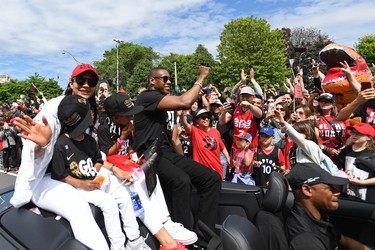 Raptors general manager Masai Ujiri and his family celebrate with fans during the Toronto Raptors Championship Parade on Lakeshore Boulevard. Gerry Angus-USA TODAY Sports