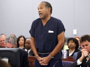 In this file photo taken on December 4, 2008, OJ Simpson speaks in court prior to his sentencing as his attorneys Gabriel Grasso (L) and Yale Galanter listen at the Clark County Regional Justice Center in Las Vegas, Nevada.