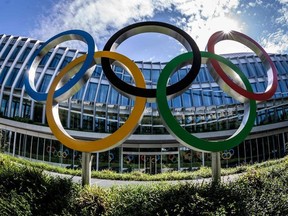 A picture taken on June 18, 2019 in Lausanne shows The Olympic Rings displayed at the entrance of the new International Olympic Committee headquarters that will be inaugurated on June 23, 2019.