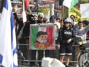 The Al Quds Day rally and march started at the 361 University Ave. courthouse, located across from the U.S. consulate, and was met by a pocket of pro-Israeli protesters and other groups on Saturday, June 1, 2019. (Jack Boland/Toronto Sun/Postmedia Network)