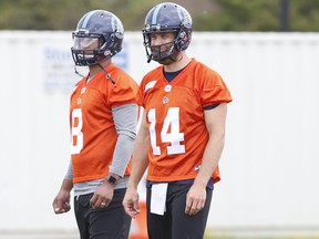 Argonauts quarterbacks James Franklin (left) and McLeod Bethel-Thompson watch what’s going on at training camp. The two could wind up sharing the job. Jack Boland/Toronto Sun