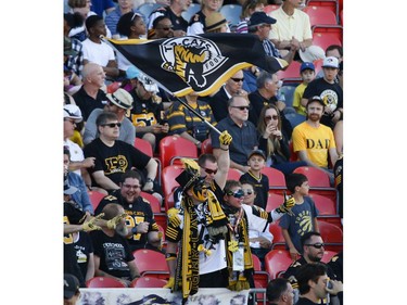 Hamilton Tiger Cats fans celebrate the win during the fourth quarter in Toronto, Ont. on Saturday June 22, 2019. Jack Boland/Toronto Sun/Postmedia Network