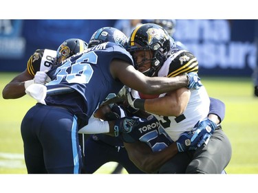 Toronto Argonauts Anthony Covington DB (37) tackles Hamilton Tiger Cats Sean Thomas Erlington RB (31) during the first half in Toronto, Ont. on Saturday June 22, 2019. Jack Boland/Toronto Sun/Postmedia Network