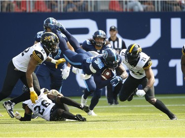 Toronto Argonauts James Wilder Jr. (32) goes over the top for short yardage during the first quarter  in Toronto, Ont. on Saturday June 22, 2019. Jack Boland/Toronto Sun/Postmedia Network