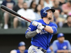 Jun 11, 2019; Baltimore, MD, USA;  Toronto Blue Jays second baseman Eric Sogard (5) hits a solo home run during the first inning against the Baltimore Orioles at Oriole Park at Camden Yards. Mandatory Credit: Tommy Gilligan-USA TODAY Sports ORG XMIT: USATSI-398452