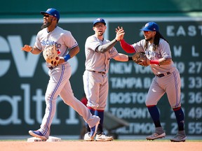 Teoscar Hernandez #37 celebrates with teammates Eric Sogard #5 and Freddy Galvis #16 of the Toronto Blue Jays after defeating the Boston Red Sox at Fenway Park on June 23, 2019 in Boston, Massachusetts. (Photo by Kathryn Riley/Getty Images)