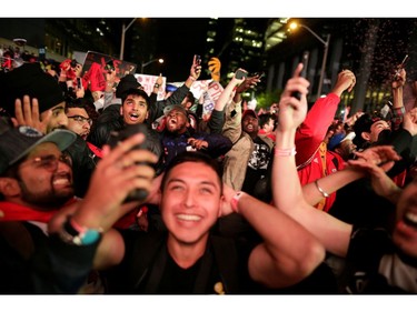Fans celebrate after the Toronto Raptors defeated the Golden State Warriors in Oakland, California in Game Six of the best-of-seven NBA Finals, in Toronto, Ontario, Canada, June 14, 2019.