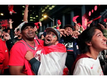 Fans celebrate after the Toronto Raptors defeated the Golden State Warriors in Oakland, California in Game Six of the best-of-seven NBA Finals, in Toronto.