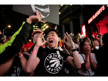 Fans celebrate after the Toronto Raptors defeated the Golden State Warriors in Oakland, California in Game Six of the best-of-seven NBA Finals, in Toronto.