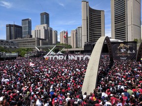 Toronto fans gather in front of the city hall during the Toronto Raptors NBA Championship celebration parade at Nathan Phillips Square in Toronto, Ontario, Canada, June 17, 2019.